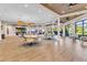 Spacious community clubhouse with modern lighting, tables, chairs and views at 4136 Cascade Falls Dr, Sarasota, FL 34243