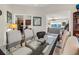 Open dining room with glass table and access to living areas and kitchen at 4136 Cascade Falls Dr, Sarasota, FL 34243