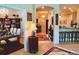 Inviting entryway with views to the breakfast bar and dining area and light wood look floors at 4136 Cascade Falls Dr, Sarasota, FL 34243