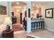 Inviting entryway featuring views of a breakfast bar and dining room, with decorative rugs and light fixtures at 4136 Cascade Falls Dr, Sarasota, FL 34243