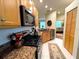 Well-appointed kitchen showcases stainless steel appliances and warm wood cabinetry at 4136 Cascade Falls Dr, Sarasota, FL 34243