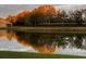 Sunlight reflects off the tranquil pond behind these well maintained homes at 4136 Cascade Falls Dr, Sarasota, FL 34243