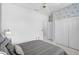 Bright bedroom features white walls, a large bed, and ample closet space for storage at 4146 Westbourne Cir, Sarasota, FL 34238