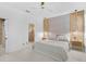 A beautifully decorated bedroom features elegant lighting and a spa-like ensuite bathroom at 4146 Westbourne Cir, Sarasota, FL 34238