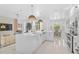Spacious kitchen with a large island, stainless steel appliances, and a view into the living room at 4146 Westbourne Cir, Sarasota, FL 34238