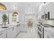 Bright kitchen with stainless steel appliances and a view of the dining area at 4146 Westbourne Cir, Sarasota, FL 34238