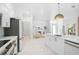 Open-concept kitchen with stainless steel appliances and view to another room at 4146 Westbourne Cir, Sarasota, FL 34238