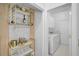 Functional space featuring a wine rack adjacent to the laundry area at 4146 Westbourne Cir, Sarasota, FL 34238