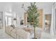 Living room featuring stylish decor, marble floors, chic seating, and bright natural light at 4146 Westbourne Cir, Sarasota, FL 34238