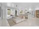 Bright living room featuring tile floors, modern furniture, and an open layout at 4146 Westbourne Cir, Sarasota, FL 34238