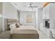 Cozy main bedroom with modern decor, a ceiling fan, and a window with natural light at 4146 Westbourne Cir, Sarasota, FL 34238