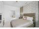 Cozy main bedroom with modern decor, a ceiling fan, and a window with natural light at 4146 Westbourne Cir, Sarasota, FL 34238