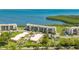 Beautiful bayfront villas with mature trees, manicured lawns, and convenient parking at 4760 Gulf Of Mexico Dr. Villa 7, Longboat Key, FL 34228