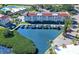 Aerial view of a building with boat docks on a waterfront property at 4760 Gulf Of Mexico Dr. Villa 7, Longboat Key, FL 34228