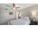 Calming bedroom with neutral decor, ceiling fan and a closet at 4760 Gulf Of Mexico Dr. Villa 7, Longboat Key, FL 34228