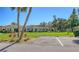 Exterior features well-maintained grounds, ample parking, and tropical landscaping, near to the residence at 4760 Gulf Of Mexico Dr. Villa 7, Longboat Key, FL 34228
