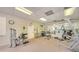 Well-equipped gym offers modern weight machines, dumbbells, and mirrored walls for a complete workout experience at 4760 Gulf Of Mexico Dr. Villa 7, Longboat Key, FL 34228