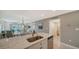 Open kitchen and dining area with spacious countertops and modern stainless steel appliances at 4760 Gulf Of Mexico Dr. Villa 7, Longboat Key, FL 34228