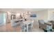 Bright kitchen featuring stainless steel appliances, island with seating, and modern countertops at 4760 Gulf Of Mexico Dr. Villa 7, Longboat Key, FL 34228