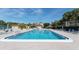 Inviting community swimming pool with ample lounge chairs for relaxation and recreation at 4760 Gulf Of Mexico Dr. Villa 7, Longboat Key, FL 34228