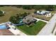 Spacious single-story home with mature landscaping, a pool, and a sprawling lawn at 5209 26Th W Ave, Bradenton, FL 34209