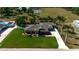 Charming single-story home with a well-manicured lawn, lush landscaping, and an inviting entrance at 5209 26Th W Ave, Bradenton, FL 34209