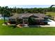 Charming single-story home with well-manicured lawn, mature landscaping, and inviting front entrance at 5209 26Th W Ave, Bradenton, FL 34209