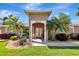 Inviting front entrance features double doors, palm trees and well-manicured landscaping at 5209 26Th W Ave, Bradenton, FL 34209