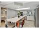 Modern kitchen with white cabinetry, stainless appliances, and a breakfast bar at 5209 26Th W Ave, Bradenton, FL 34209