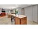 Open kitchen and dining area with island seating and a view to the outside pool and patio at 5209 26Th W Ave, Bradenton, FL 34209