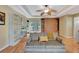 Comfortable living room with built-in shelving, a ceiling fan, and a sofa with decorative pillows at 5209 26Th W Ave, Bradenton, FL 34209