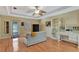 Relaxing space with hardwood floors, natural light, a ceiling fan, and built-in bookshelves at 5209 26Th W Ave, Bradenton, FL 34209