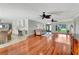 Expansive living space with hardwood floors, ceiling fans, and an open layout, perfect for modern living at 5209 26Th W Ave, Bradenton, FL 34209