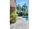 Beautiful in-ground pool surrounded by lush, tropical landscaping and a paved patio at 5209 26Th W Ave, Bradenton, FL 34209