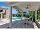 Outdoor pool patio with a covered seating area, perfect for entertaining or relaxing by the beautiful swimming pool at 5209 26Th W Ave, Bradenton, FL 34209
