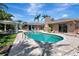 A stunning swimming pool surrounded by a paver patio and tropical landscaping offering a private outdoor oasis at 5209 26Th W Ave, Bradenton, FL 34209