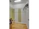 Functional walk-in closet with metal shelving and laminate wood flooring; perfect for storage at 5209 26Th W Ave, Bradenton, FL 34209