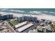 Aerial view of a beachfront condominium with parking and nearby residential neighborhood at 5300 Gulf Dr # 204, Holmes Beach, FL 34217