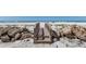 Wooden beach boardwalk on a sandy dune with an ocean backdrop at 5300 Gulf Dr # 204, Holmes Beach, FL 34217