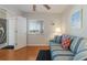 Bright bedroom with a window, comfortable couch, and interior access to enclosed porch at 5300 Gulf Dr # 204, Holmes Beach, FL 34217
