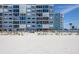Condominium building with beautiful beach access on a sunny day at 5300 Gulf Dr # 204, Holmes Beach, FL 34217