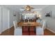 Dining table with a modern kitchen featuring stainless steel appliances in the background at 5300 Gulf Dr # 204, Holmes Beach, FL 34217
