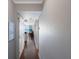Inviting hallway featuring hardwood floors, leading to an ocean view with natural light at 5300 Gulf Dr # 204, Holmes Beach, FL 34217