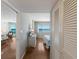 Hallway view leading to a bedroom with ocean views and a cozy living space at 5300 Gulf Dr # 204, Holmes Beach, FL 34217