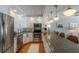 Stylish kitchen with stainless appliances, custom cabinetry, and sleek countertops at 5300 Gulf Dr # 204, Holmes Beach, FL 34217