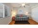 Bright living room with sofa, end tables, lamps, and ceiling fan providing ample light at 5300 Gulf Dr # 204, Holmes Beach, FL 34217