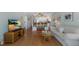 Bright and airy living room with modern furniture and an open concept kitchen with stainless steel appliances at 5300 Gulf Dr # 204, Holmes Beach, FL 34217
