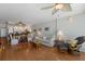 Bright living room offering comfortable seating, seamless flow to dining and kitchen areas, and ceiling fan at 5300 Gulf Dr # 204, Holmes Beach, FL 34217
