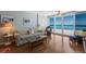 Comfortable living room offers ocean views, lots of seating, and hardwood floors at 5300 Gulf Dr # 204, Holmes Beach, FL 34217
