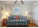 Cozy living room with sofa, end tables, lamps, and ceiling fan providing ample light at 5300 Gulf Dr # 204, Holmes Beach, FL 34217